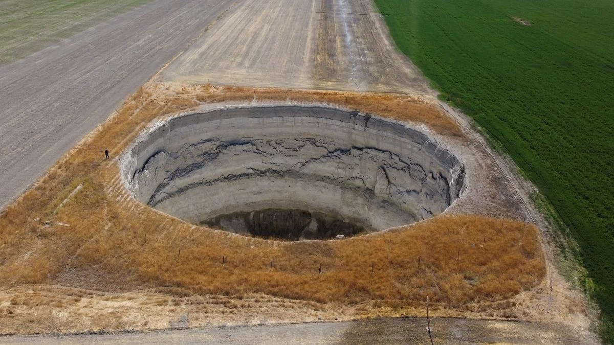 Giant sinkholes emerge sparking fears it’s warning from God