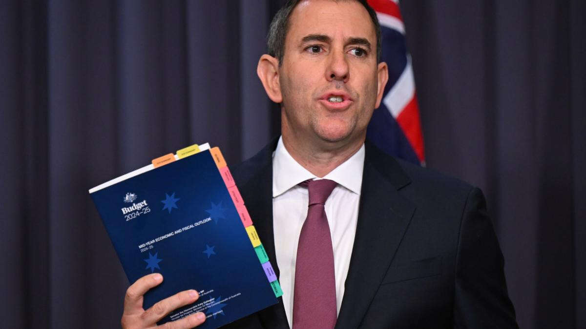 Australia’s finances slugged by $22b downgrade in budget update