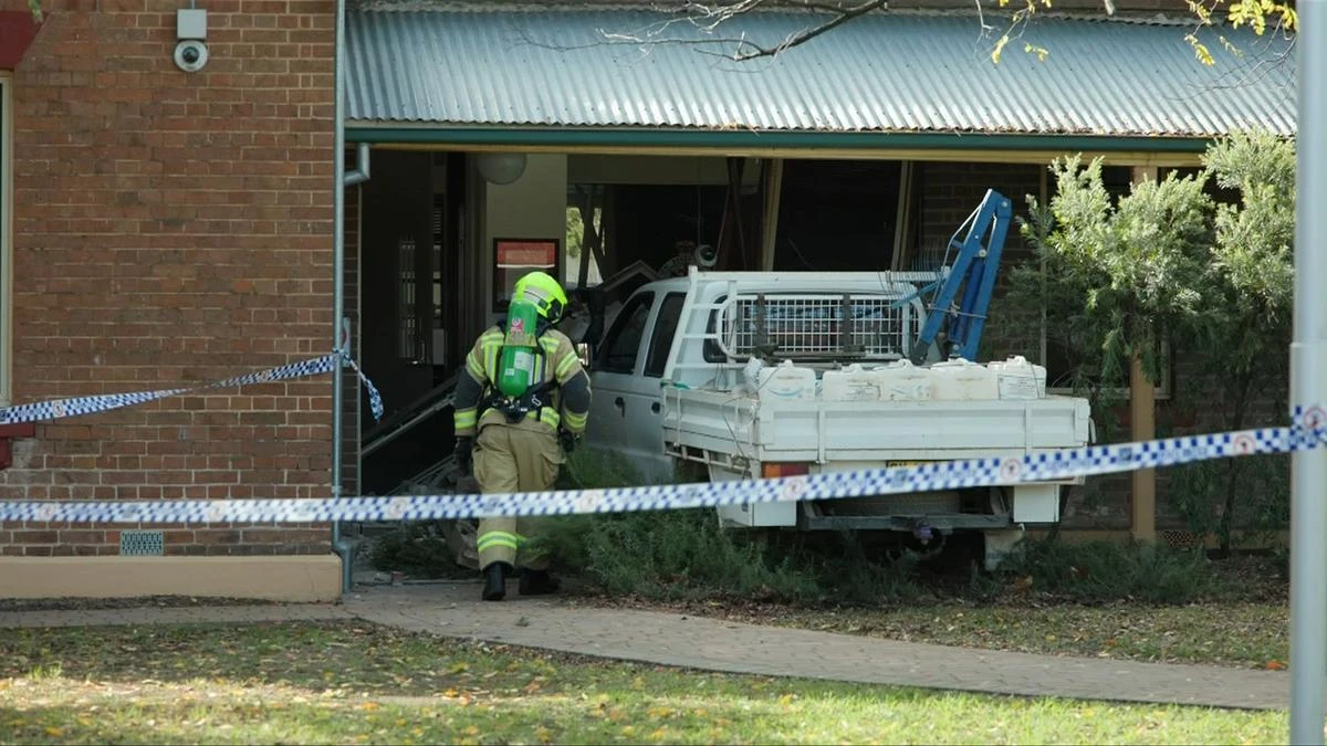 Driver allegedly drove at officers and crashed into station