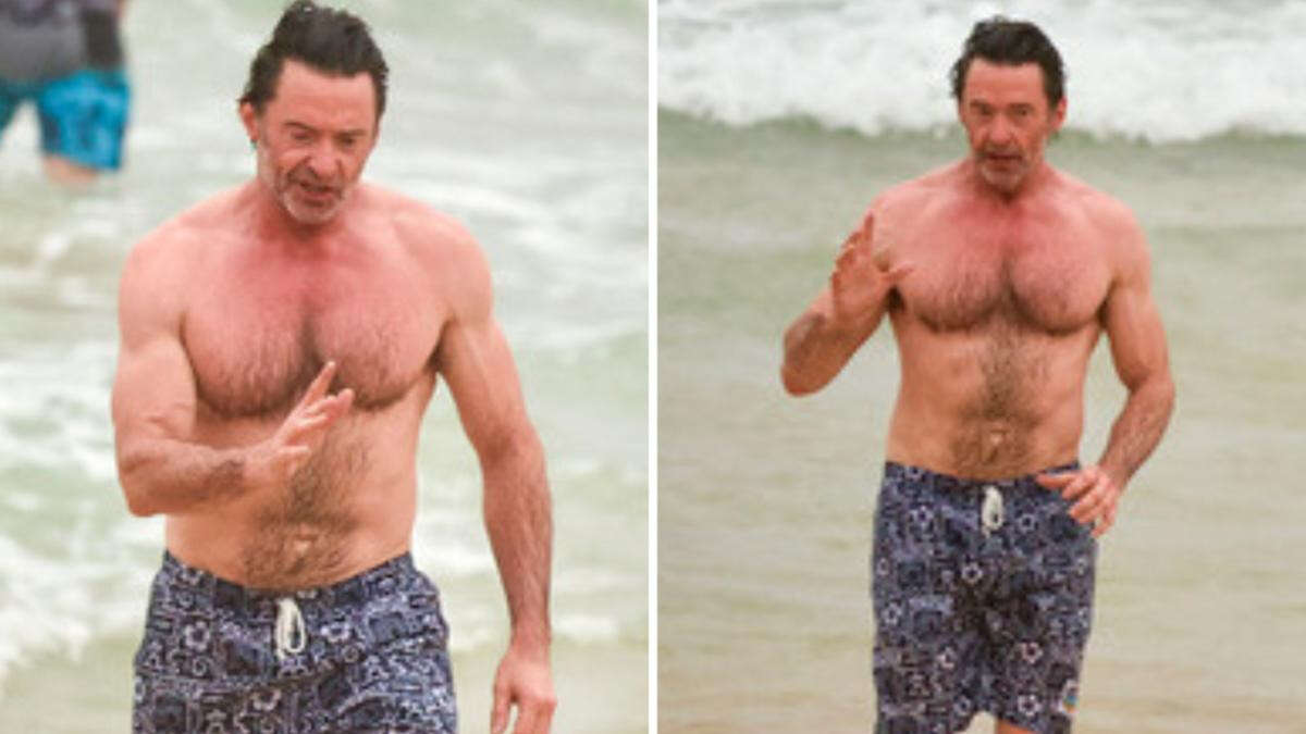 Hugh Jackman shows off his ripped physique as he takes a dip at Bondi Beach