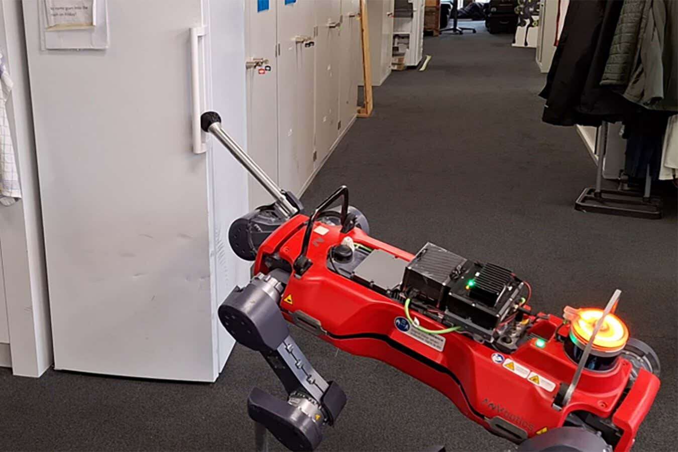 A robot dog has learned to open doors with its leg