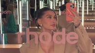 Hailey Bieber’s growing baby bump seen in tight dress at Rhode pop-up shop as Kylie Jenner praises pregnant star
