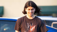 Michael Jackson’s reclusive son Blanket, 22, looks elated as he charges his blue Tesla in LA during rare public outing