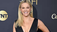 Reese Witherspoon, 48, wears plunging black dress and flashes her curves as she attends AFI Life Achievement Award event