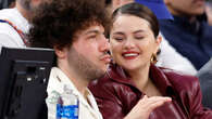 Selena Gomez and boyfriend Benny Blanco pack on the PDA as they cuddle up while courtside at Knicks versus 76ers game