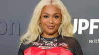 Lizzo shows off tiny waist and 60lb weight loss in red corset and miniskirt at Amazon event