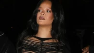 Rihanna stuns as she shows off baby bump in sexy black body suit at Paris Fashion Week