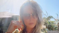 Heidi Klum, 51, puts her breasts on quite the display in jewel-covered bikini while lounging in the sun