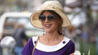 Baywatch babe Donna D’Errico, 57, looks ageless in tight purple dress decades after she slipped into iconic red swimsuit