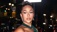 Jordyn Woods gives glimpse of underboob in turquoise gown as she struts into New York Fashion Week bash