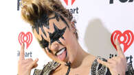 JoJo Siwa debuts goth makeup in sheer catsuit as fans say star is in her ‘2013 Miley Cyrus era’ at iHeartRadio Awards