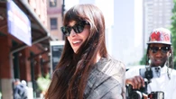 Dakota Johnson rocks totally see-through dress and flashes a smile after split from fiance Chris Martin