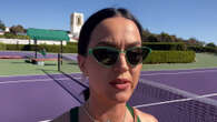 Katy Perry flaunts figure in tight tennis fit as she pans camera down to belly after pregnancy rumors