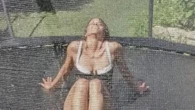 Halle Berry, 58, bounces on trampoline in just a cheeky swimsuit as she’s sprayed with a hose