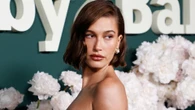 Hailey Bieber reveals ‘pain’ she’s feeling from pregnancy as she pouts in new photo that shows off growing baby bump