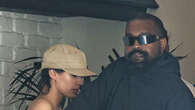 Kanye West attempts to hide wife Bianca Censori from cameras as she steps out wearing a nude sheer top in Los Angeles