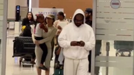 Bianca Censori shows motherly side as she carries stepdaughter Chicago, 6, at airport with Kanye on South Korea trip