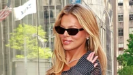 Brooks Nader goes braless under see-through blouse, hot pants and heels as she waves to fans on NYC street