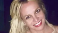 Britney Spears suffers wardrobe malfunction in sparkly gold lingerie as she dirty dances to Janet Jackson at home