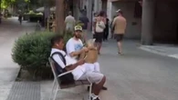 Bizarre moment Oscar-winning Hollywood star shares loaf of bread with Spanish local who’s no idea who he is – would you?