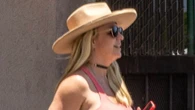 Britney Spears says her ‘body isn’t perfect’ and claps back at ‘unflattering’ pics as star wears tight dress after trip