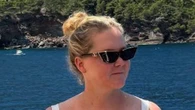 Amy Schumer shows off weight loss in a stunning swimsuit on yacht as fans gush over ‘amazing’ new look