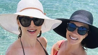 Jane Seymour, 74, looks decades younger as she shows off fit figure in a pink swimsuit at beach with pal Heather Graham