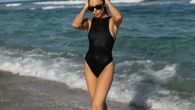 Nepo baby with HUGE 80s movie star dad looks incredible in black swimsuit – but can you guess who her famous father is?