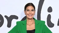 Teri Hatcher, 59, hits the beach on Corsica getaway in lace-up black swimsuit and reveals she’s ‘falling in love’