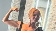Jewel, 51, puts muscular legs on display in black swimsuit for bathroom selfie