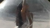 Bianca Censori spills out of plunging silver bodysuit while trapped inside a bubble for bizarre look