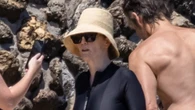 Julianne Moore, 64, puts on perky display in black swimsuit as actress shows off stunning figure on Italy vacation