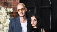 Charli XCX says she’s ‘jealous’ of her 1975 rocker fiancé George Daniel playing ‘bigger’ shows than her in rare comments