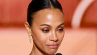 Zoe Saldana bizarrely crashes Golden Globes stage during Best Song speech as ’embarrassed’ fans beg star to ‘sit down’