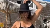 Former MTV bombshell, now 58, looks ‘just like she did in the 90s’ while dancing in tiny swimsuit on yacht