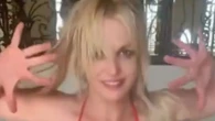 Britney Spears dances in a red string bikini with boots and mask to flamenco music before quickly deleting video