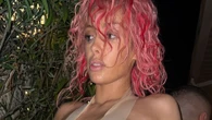 Bianca Censori goes topless & spills out of tape outfit as she cozies up to male friend with Kanye West nowhere in sight