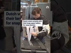 Dutch voters wrestle with their large paper ballots for snap election