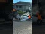 Aussie man doesn't realise his car is on FIRE