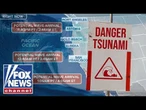 Tsunami sirens sound in Hawaii warning residents to 'seek higher ground' following 8.8 quake