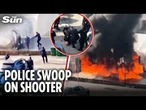 Moment armed cops swoop on 'shooter' outside parliament in Serbia as suspect starts huge fire