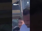 Video shows Los Angeles police officer punching man in handcuffs
