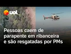 Pessoas caem em ribanceira de parapente e precisam ser resgatas por águia da PM; veja vídeos