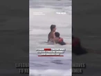 Lifeguard battles TOWERING waves to rescue struggling swimmer #shorts #us #news #foxnews #viral