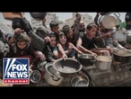 'HUMAN TIDAL WAVE': Desperate Gazans swarm aid site