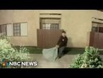 Husband of dead woman seen dragging bag with large object