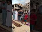 Palestinians in southern Gaza held Eid al-Adha prayers among the ruins of destroyed buildings.