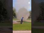 Towering dust devil interrupts baseball game in Buffalo suburb