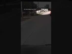 WATCH: A driver illegally passes a stopped school bus as a child nearly steps onto the road #shorts