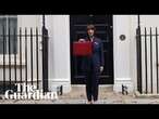 Rachel Reeves holds up the red box to the press at Downing Street ahead of the budget